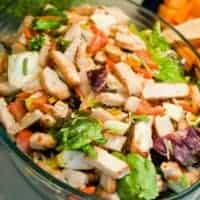 ensalada de pollo, spanish chicken salad in a glass bowl