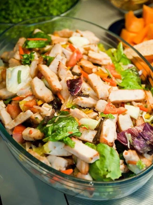 ensalada de pollo, spanish chicken salad in a glass bowl