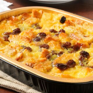 spanish bread pudding in a tray on a kitchen towel. Easy desserts from Spain