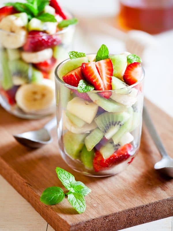 spanish fruit salad in 2 glass cups.