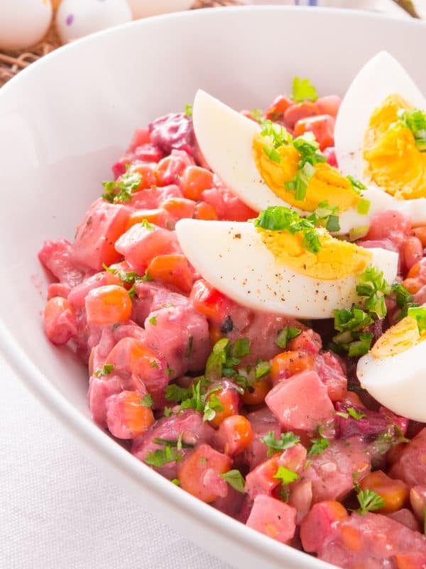 spanish potato and beet salad with boiled egg on top