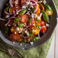 spanish tomato salad with onion and cheese on a bowl