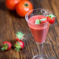 strawberry gazpacho with tomatoes in a glass.