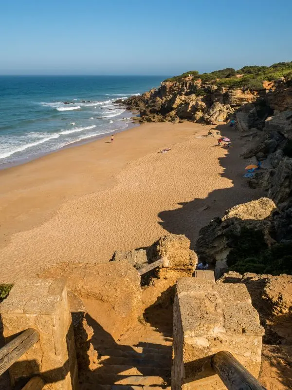 surfing in Andalucia at a secluded beach at Lugar Secreto, Cadiz
