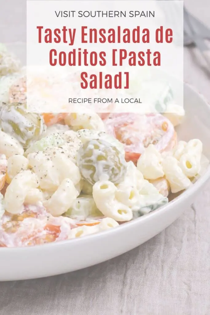 closeup of a ensalada de coditos, spanish pasta salad with cheese and ham.