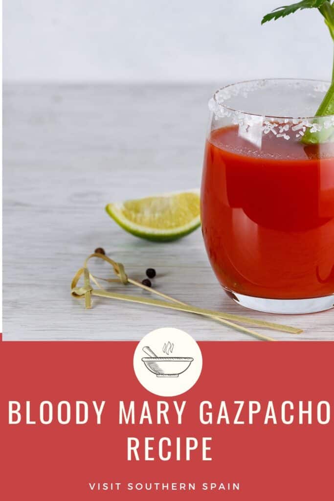 a pin with a glass of bloody mary gazpacho next to a slice of lemon