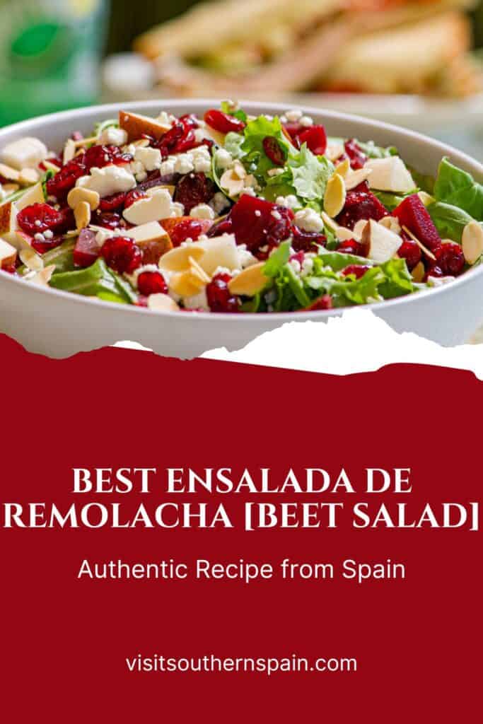 a pin with a ensalada de remolacha, spanish beet salad with feta, lettuce, onion and walnuts in a bowl. 