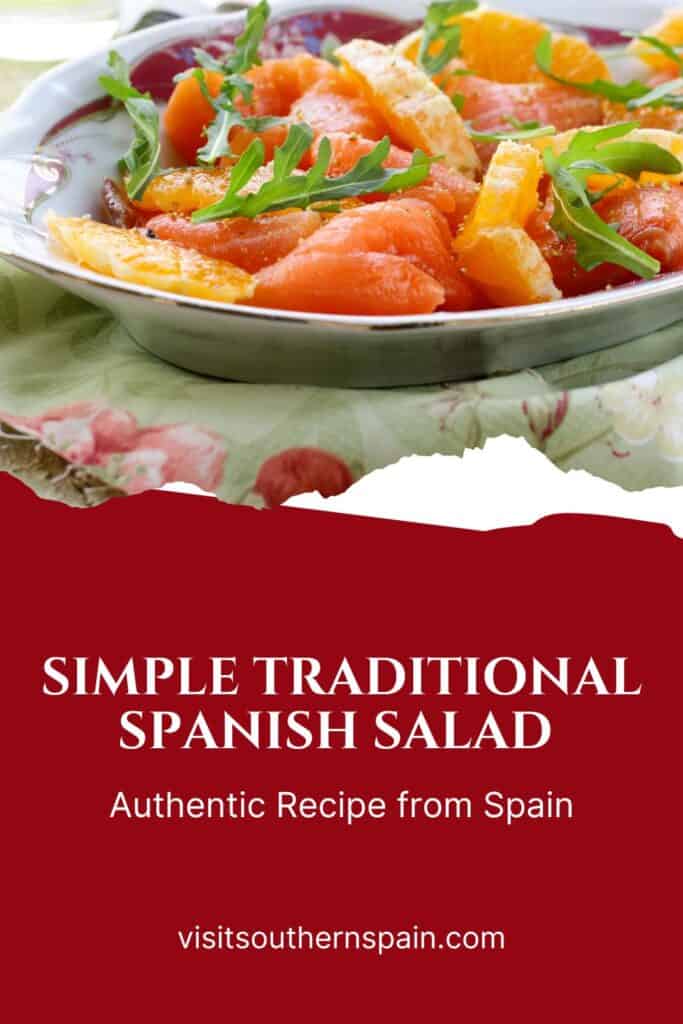 a pin with traditional spanish salad in a bowl with oranges, onion and cod fish. 