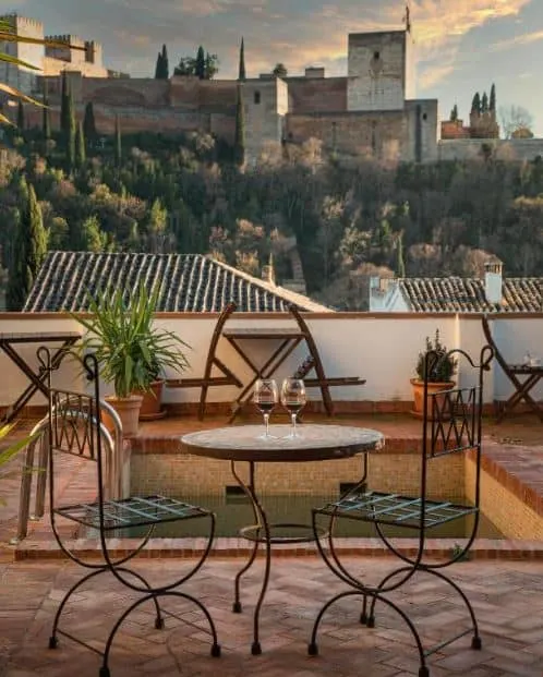 beautiful sunset from the rooftop of the Casa Bombo with view of Alhambra