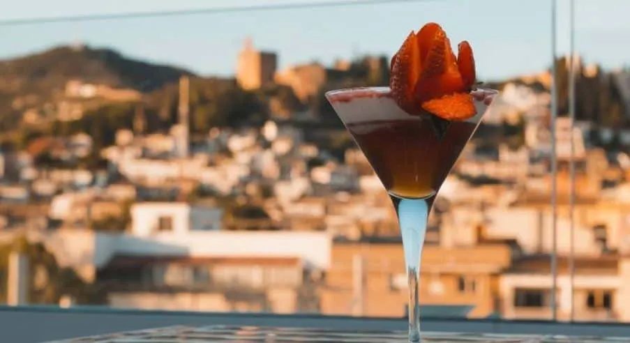 closeup with a drink at the B-Heaven Bar with views of Granada city