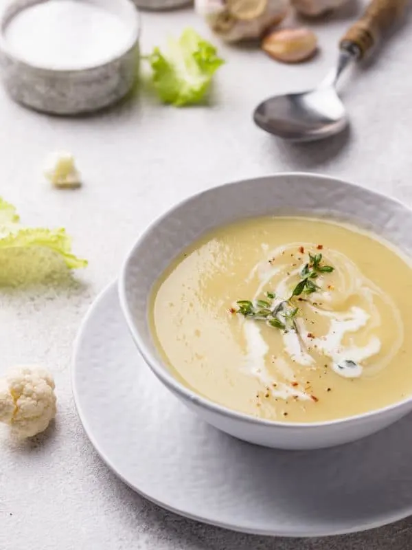 cold cauliflower soup in a white bowl - Spanish Cold Cauliflower Soup Recipe