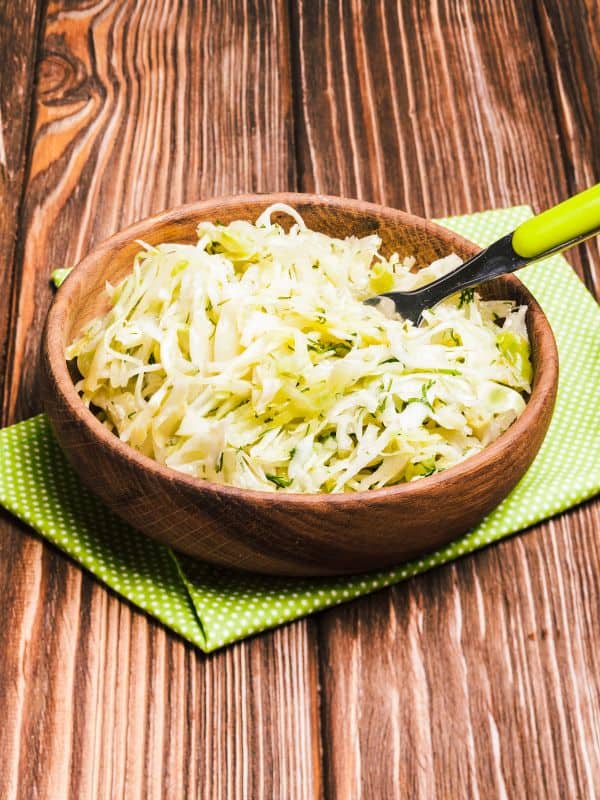 ensalada de repollo, cabbage salad from Spain in a wooden bowl.
