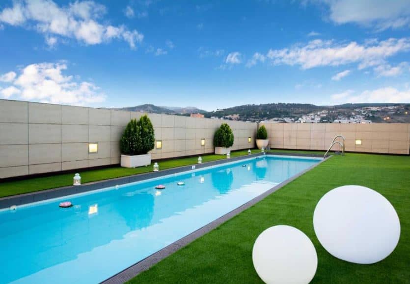 outdoor pool with views of Granada at the hotel Andalucia Center