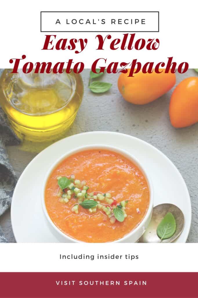 a pin with a bowl of yellow tomato gazpacho with a bottle of olive oil next to it.