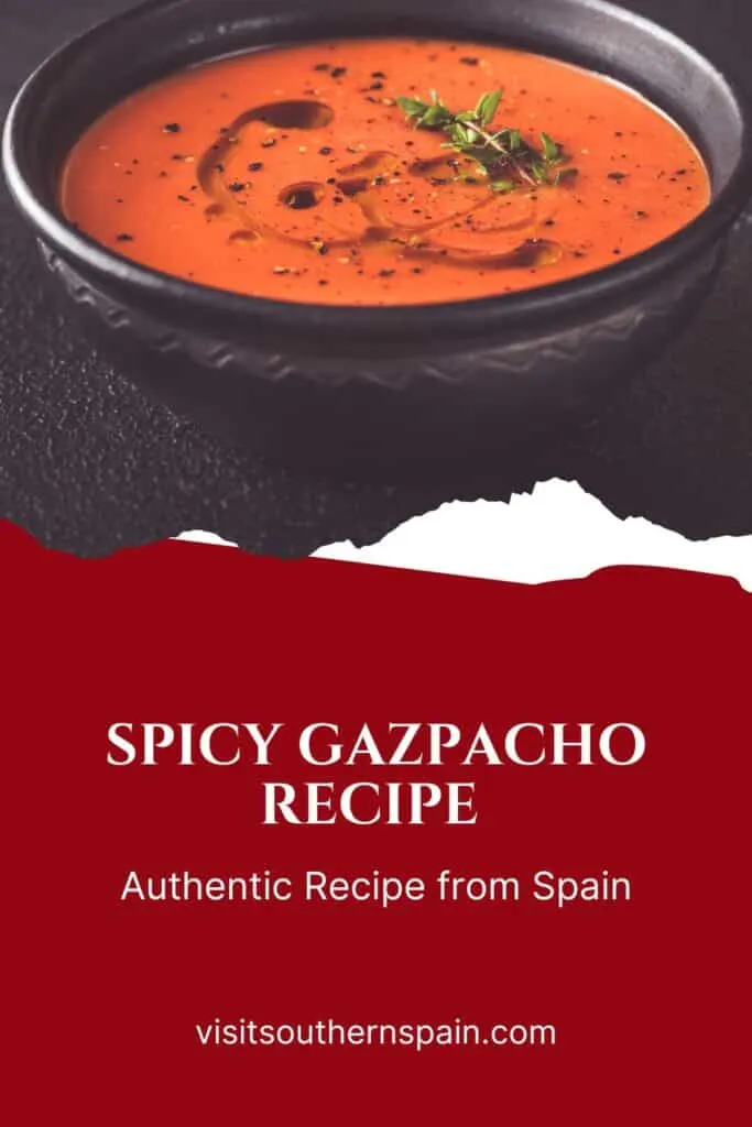 a pin with a black bowl of spicy gazpacho.