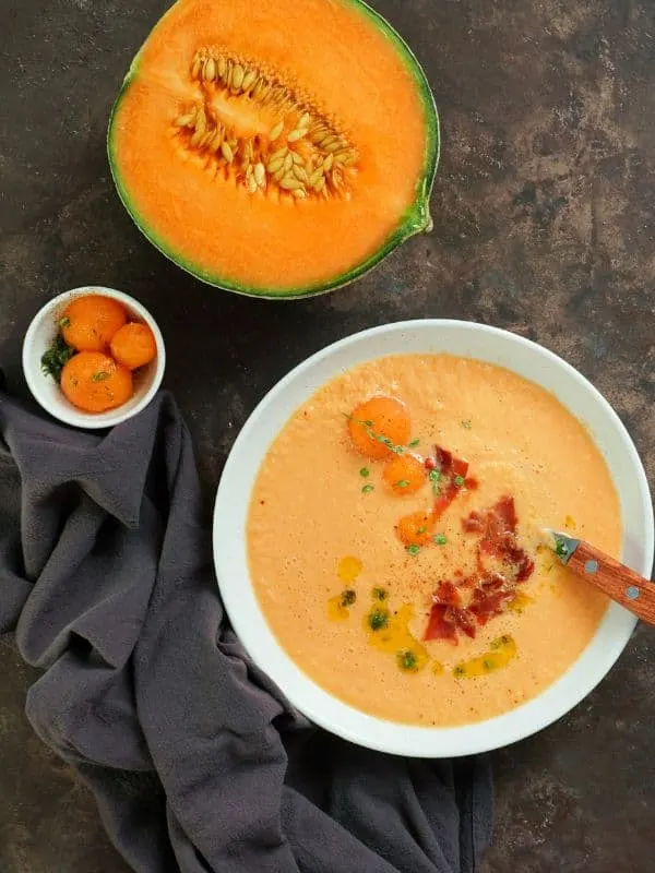 Cantaloupe Gazpacho in a bowl on a table - Delicious Cantaloupe Gazpacho Recipe from Spain