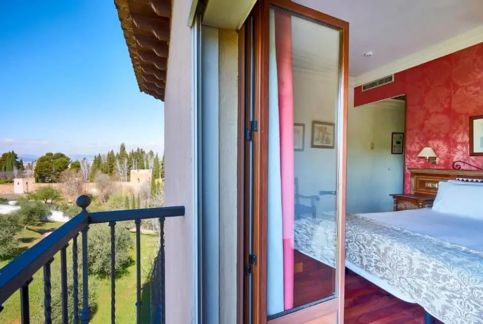 bedroom with balcony overlooking Alhambra at Crisol Guadalupe