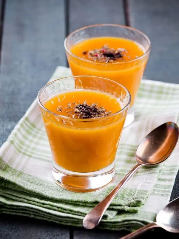 cold Pumpkin soup in 2 glasses served on a napkin. - Cold Pumpkin Soup Recipe from Spain