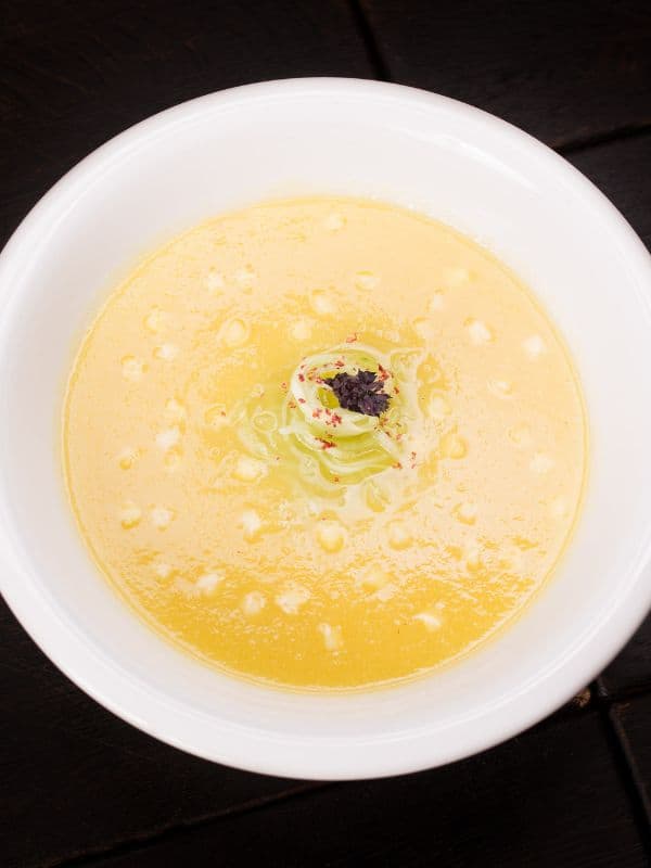cold pear soup served in a white bowl