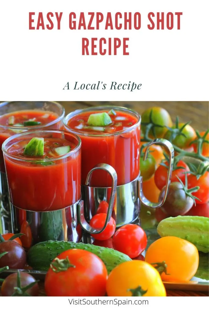 a pin with gazpacho shot recipes in serving glasses surrounded by tomatoes.