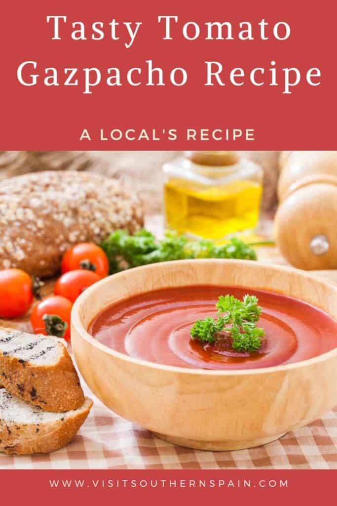 a pin with a bowl of the best tomato gazpacho with bread and gazpacho ingredients next to it.