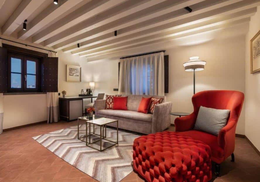 living room with sofa and armchair at Áurea Casa Palacio Sagasta by Eurostars Hotel Company, luxury hotels in Andalucia