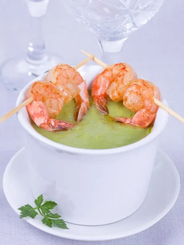 pea gazpacho in a bowl served with shrimp