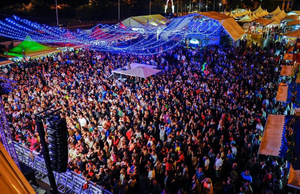 people attending a festival in Seville in June