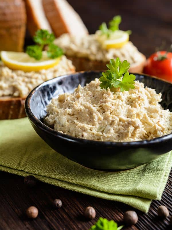 Mackerel Pate Recipe in a black bowl with bread in the background