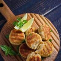 Mackerel patties on wooden board served with lemon made with the easy Mackerel patties Recipe