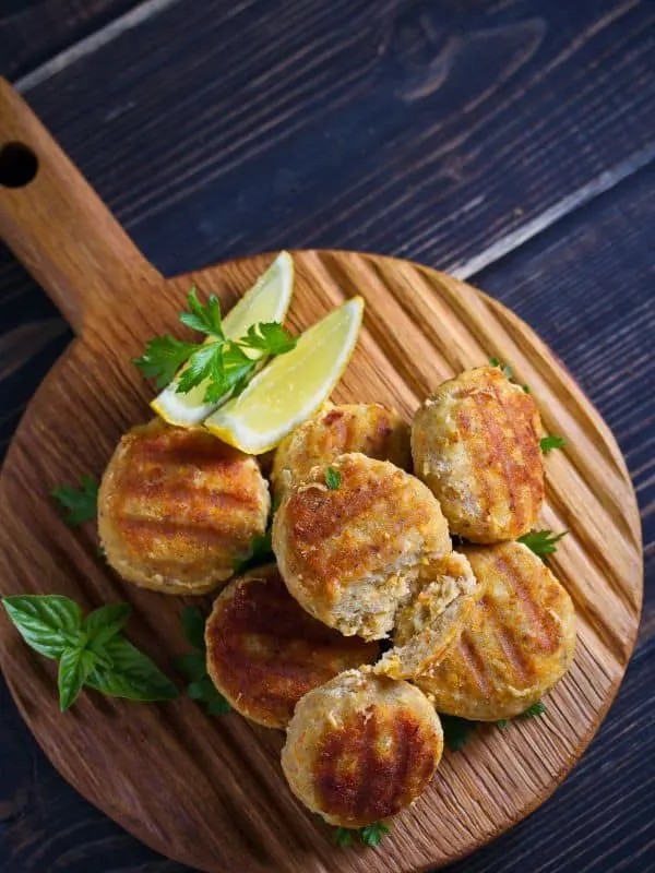 Mackerel Patty recipe on wooden board served with lemon - Best Mackerel Patty Recipe from Spain