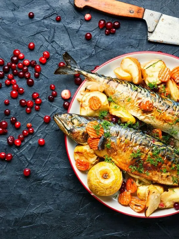 Spanish Baked Mackerel Recipe on a plate served with various vegetables