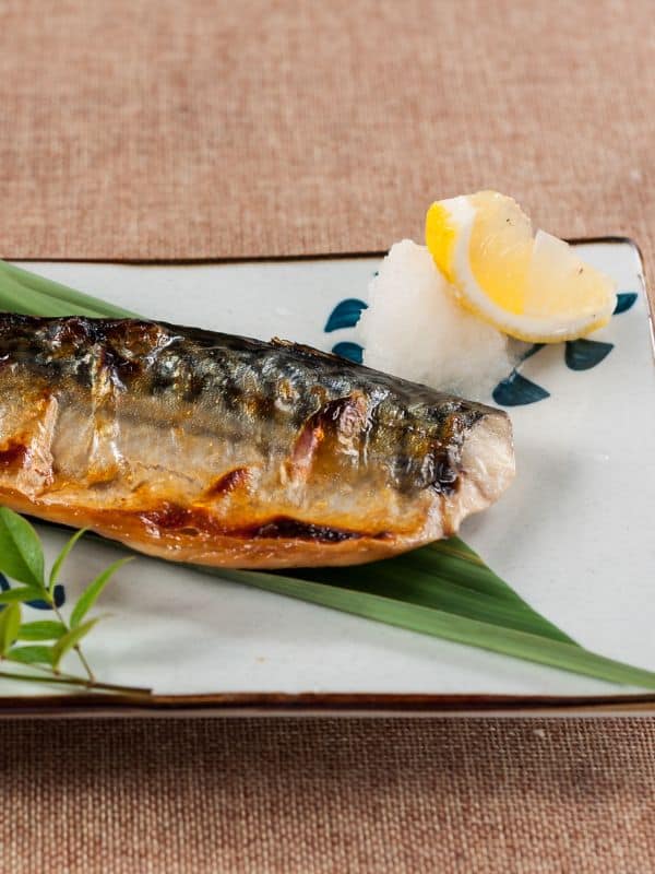 fresh mackerel recipe on a plate with lemon