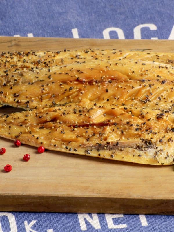 peppered mackerel recipe on a wooden board.