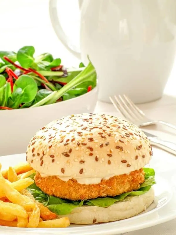a burger and fries on a plate made with the Mackerel Burger Recipe