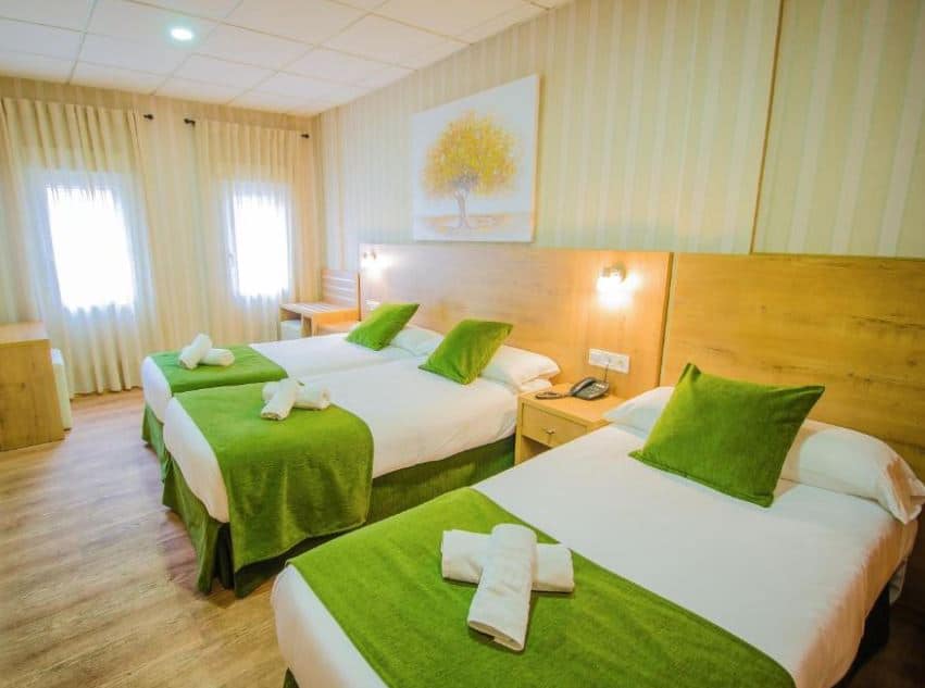bedroom with 2 separate beds at Hotel Solymar, best malaga beach hotels