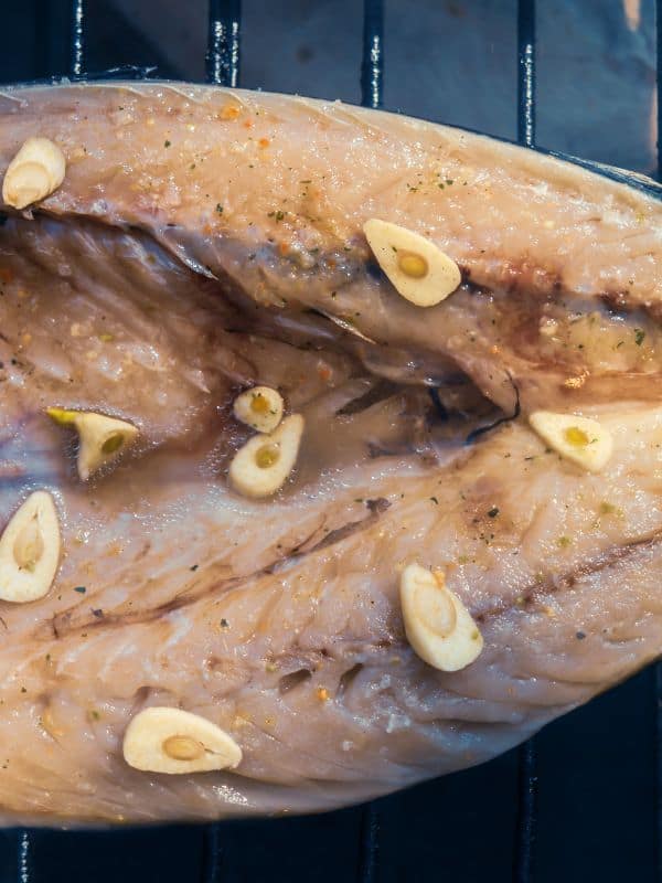closeup of a smoked mackerel recipe being made on a grill