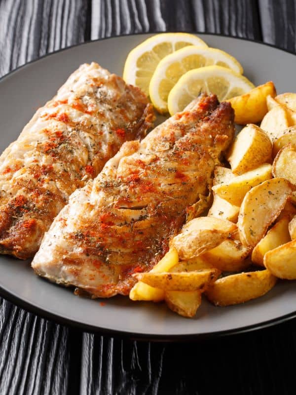 mackerel fillet recipe served with potato wedges and lemon
