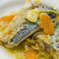 steamed mackerel recipe with carrots and onion on a plate