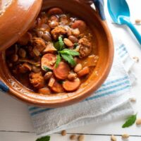 spanish baked bean soup with chorizo in a clay pot