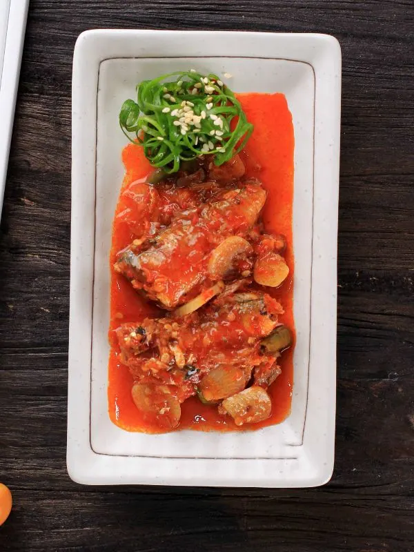 spicy mackerel recipe in a white plate.
