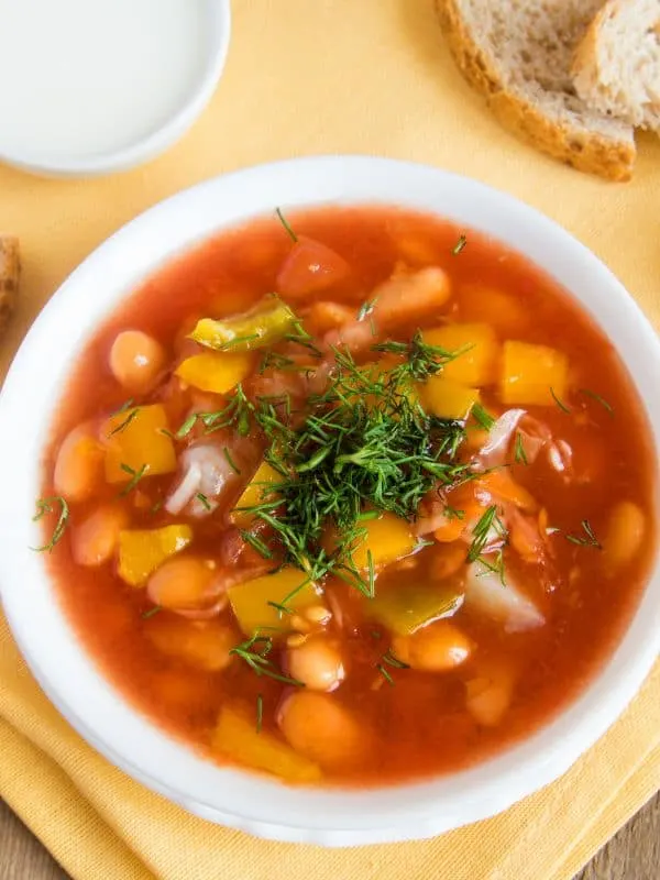 A bowl of spanish soup with chickpeas
