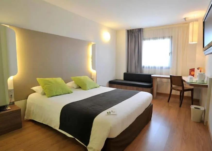 interior of a bedroom at Campanile Málaga Airport, best hotels near Malaga Airport