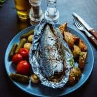 frozen mackerel recipe made in the oven and served with potatoes and other vegetables