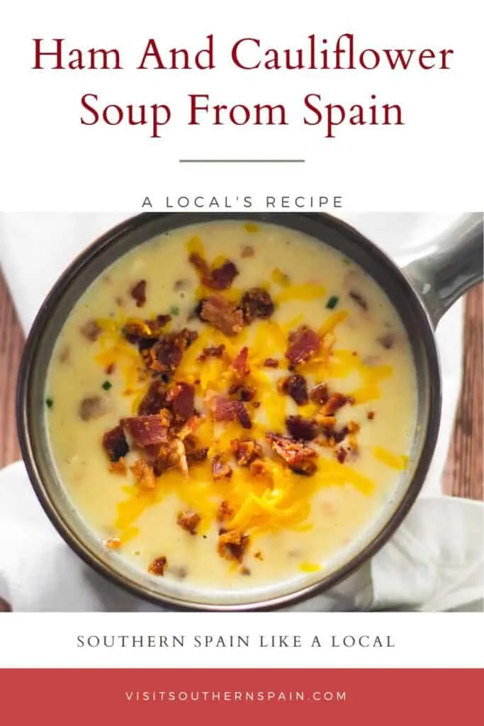 a pin with a bowl of ham and cauliflower soup from Spain in a cup.