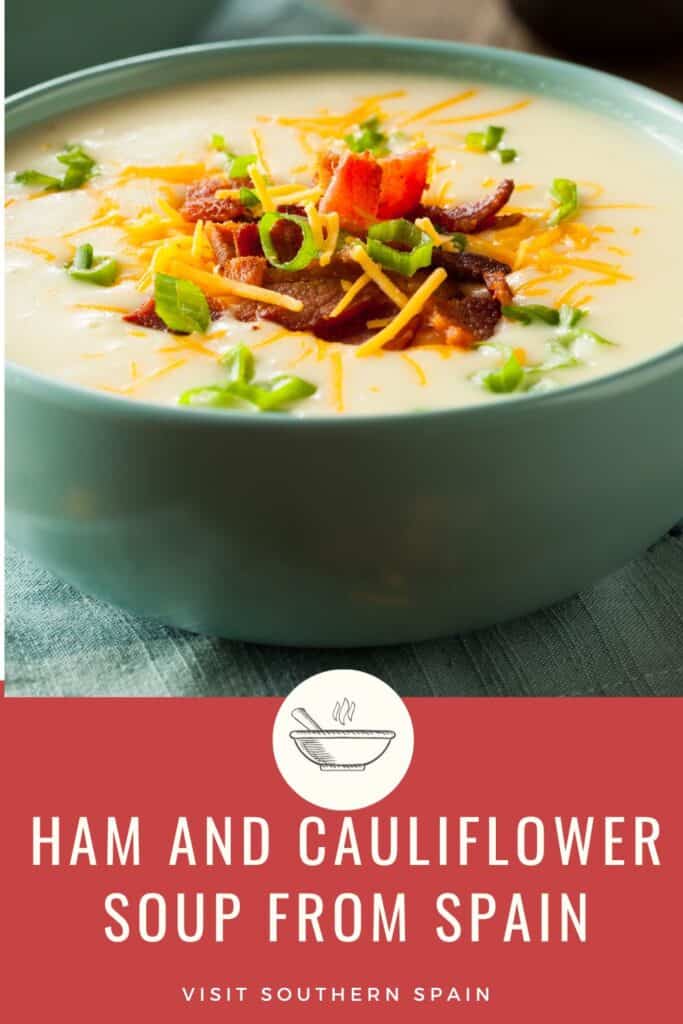a pin with a ham and cauliflower soup from Spain in a bowl.