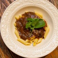 a bowl of oxtail pasta made with the oxtail ragu recipe