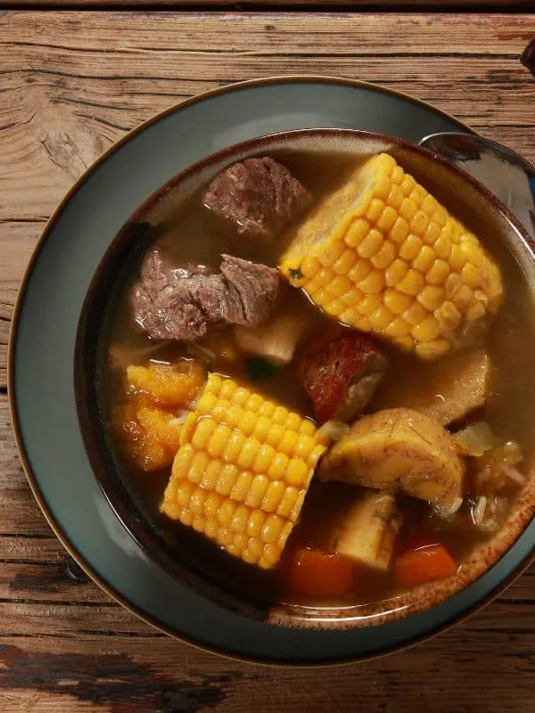 mexican oxtail soup with corn kernel and vegetables