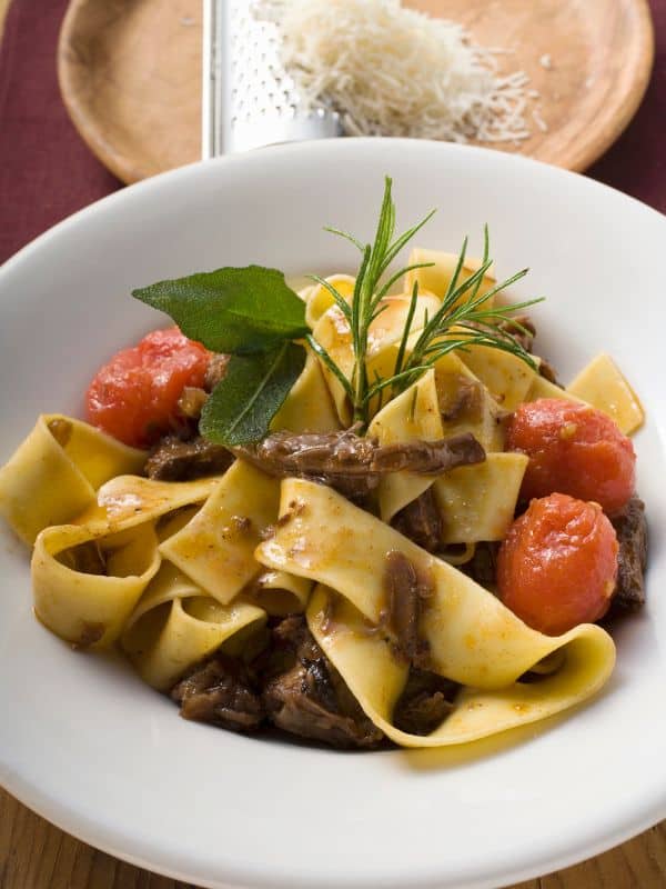 oxtail rasta pasta recipe with ribbon pasta and tomatoes