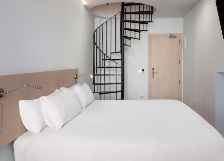 bedroom with staircase at the B&B HOTEL Málaga Centro